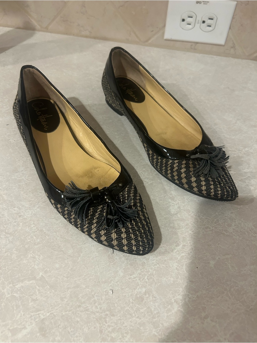 Cole Haan Black Woven Pointed-Toe Flats with Tassel Accent - Picture 1 of 6
